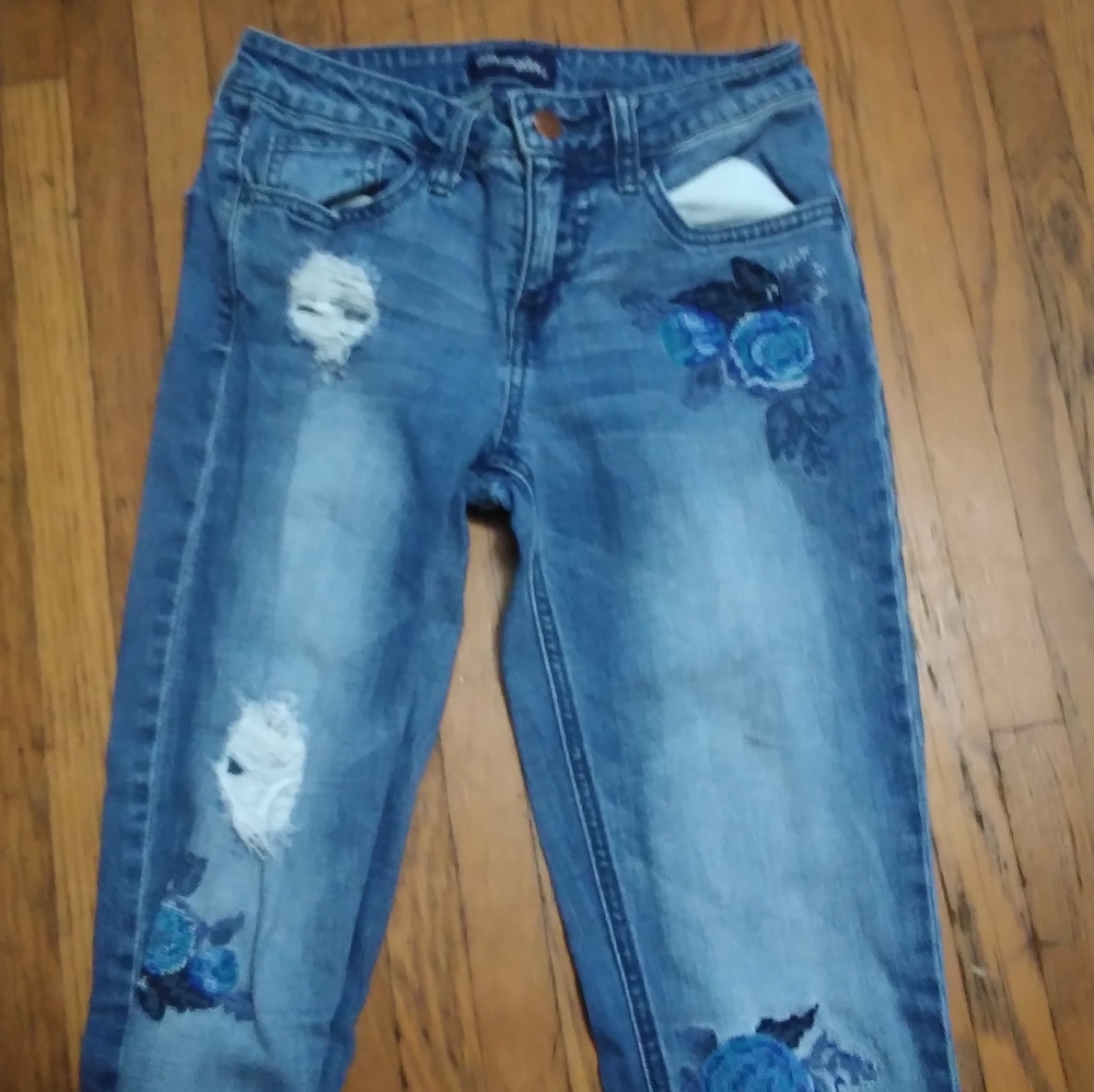 Ripped blue flower jeans